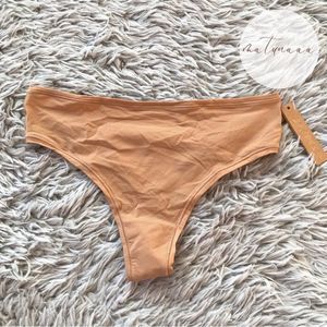 Skims Fits Everybody Thong in Ochre S